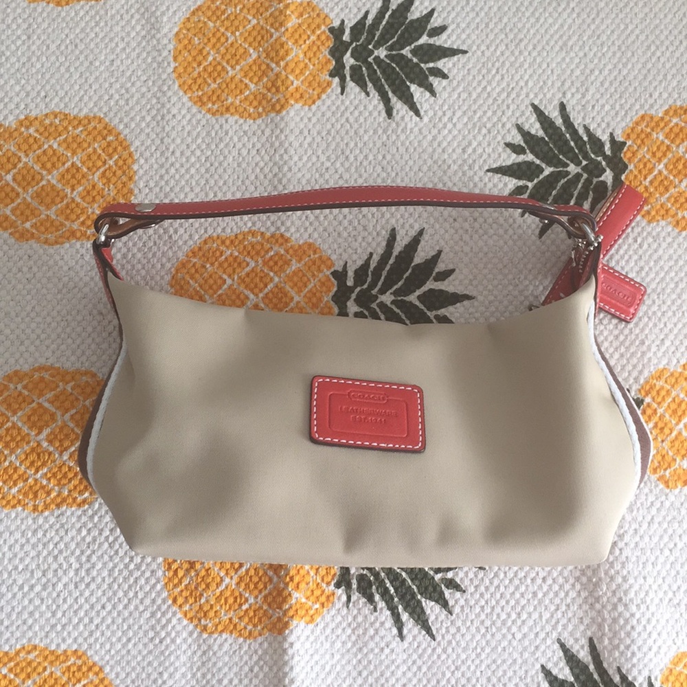 Tan and orange coach wristlet